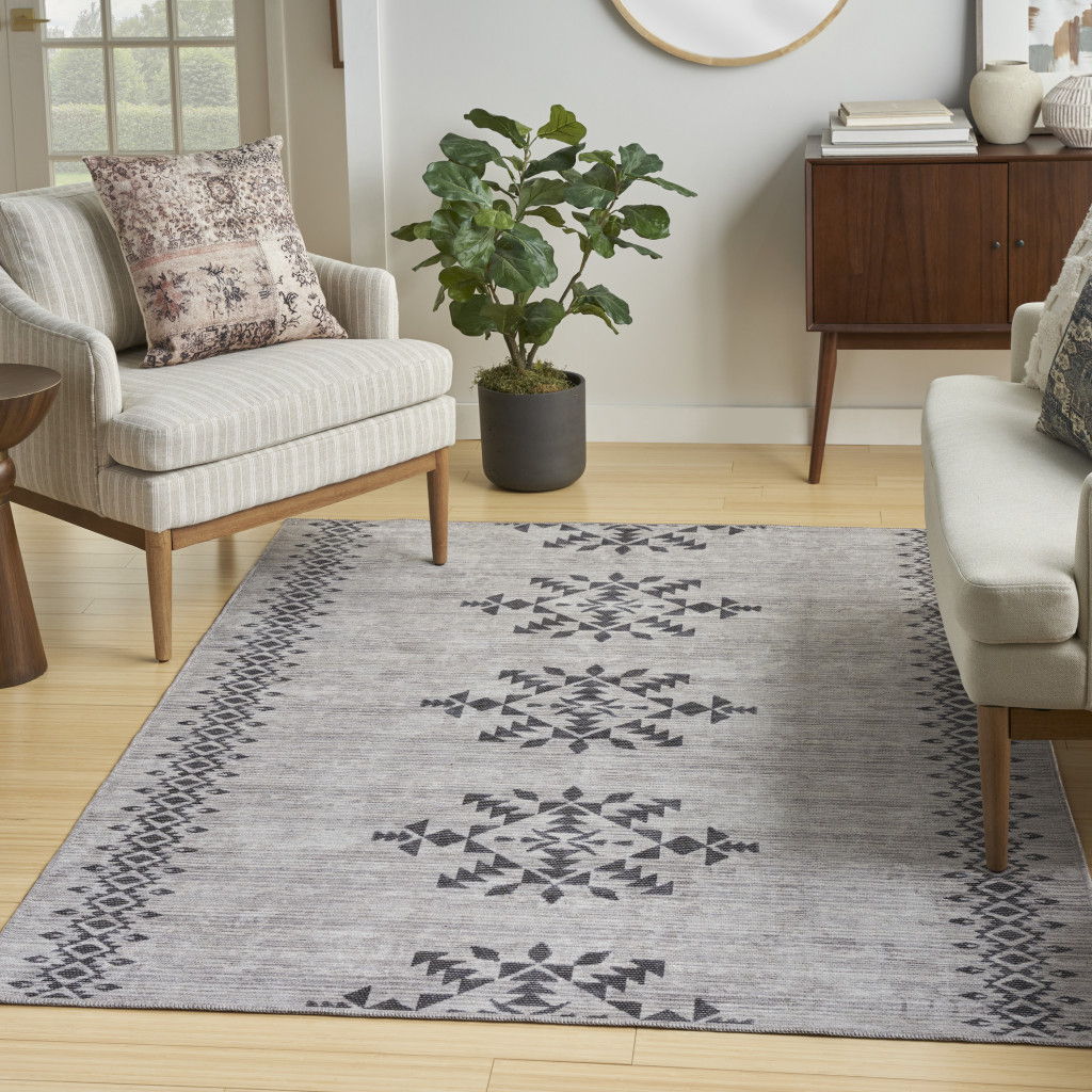 5' x 7' Geometric Power Loom Washable Area Rug - Gray And Ivory